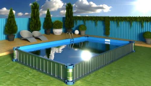 A rectangular above-ground pool in a yard with decking, lounge chairs, potted plants, and a blue fence.