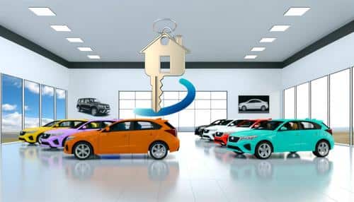 Car showroom with colorful cars and a large house-shaped key in the foreground.