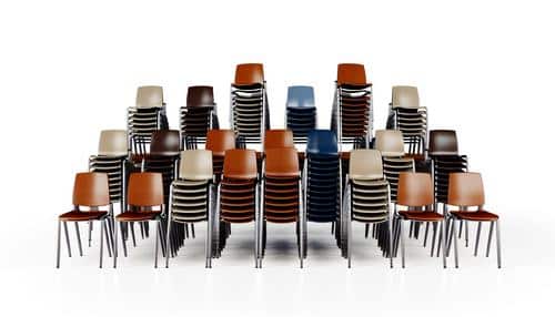 Stacks of colorful chairs arranged in rows on a white background.