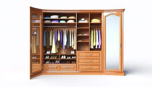 A wooden wardrobe with open doors showing hanging clothes, shelves with folded garments, and shoes organized below.