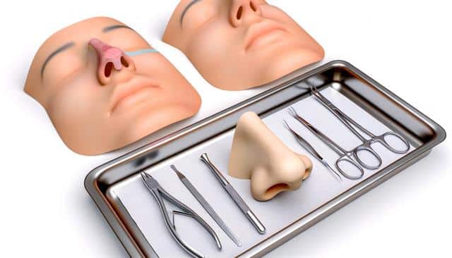 Medical training mannequins with nasal surgery tools and a prosthetic nose on a tray.