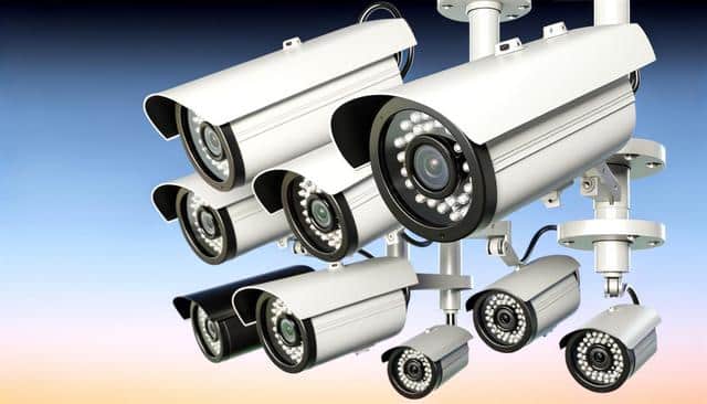 Multiple security cameras with a blue background.