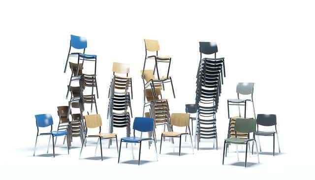 Stacks of colorful, modern chairs on a white background.