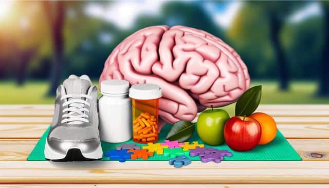 A sneaker, pill bottles, fruits, puzzle pieces, and a brain model on a wooden surface with a blurred outdoor background.