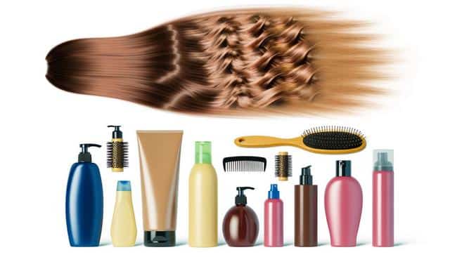 Hair care products with flowing brown hair and various brushes and bottles.