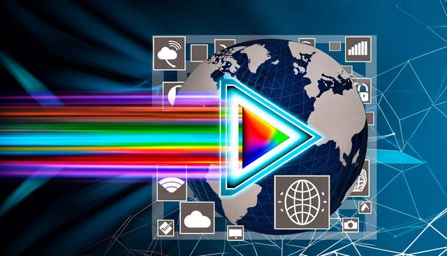 A digital globe with a large play button, rainbow lines, and technology icons.