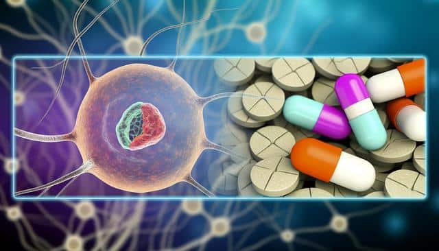 A neuron on the left and colorful capsules on top of round tablets on the right.