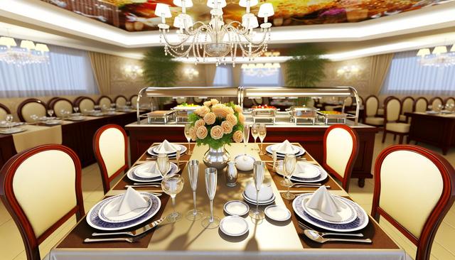 Elegant dining room with set tables, white plates, folded napkins, and a floral centerpiece under a chandelier.