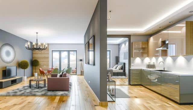 Modern open-plan living room with a kitchen, dining area, and bedroom; features wooden floors, sleek cabinets, and bright furnishings.