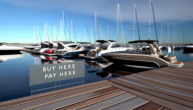 A dock with several yachts and a sign saying "Buy Here, Pay Here."