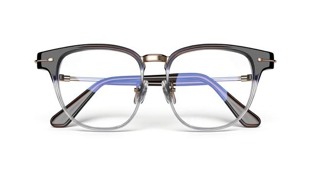 Stylish eyeglasses with a black and clear frame, blue accents, and gold details.