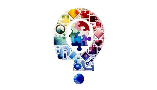 Colorful abstract question mark with puzzle pieces and geometric shapes.