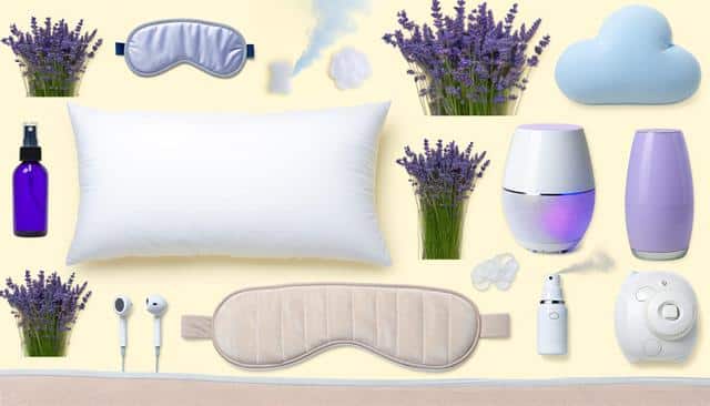 A collection of sleep aids including a white pillow, lavender sprigs, sleep masks, an eye mask, diffuser, aromatherapy items, earbuds, and a small plush cloud on a light background.