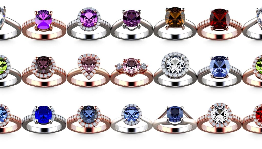 A variety of colorful gemstone rings with different shaped settings in rose and white gold.